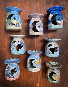 there are many vases that have been painted to look like animals in the ocean