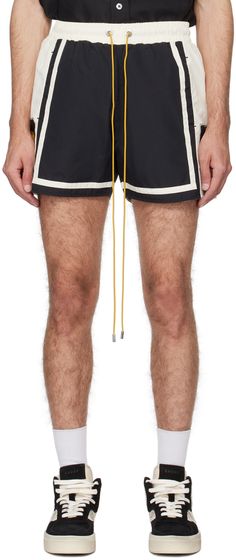 Nylon taffeta shorts. · Drawstring at elasticized waistband · Three-pocket styling · Vented cuffs · Logo graphic printed and stripes at outseams · Full twill lining · Logo-engraved silver-tone hardware Supplier color: Black/Ivory