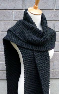 "This beautiful hand knitted scarf is made with chunky weight Wool Blend Yarn (80% Acrylic, 20% Wool). The pattern looks the same on both sides. The scarf can be worn in multiple ways. Amazing color for the fall/winter season. It goes with everything. The color may appear slightly different on different monitors. Measures: 83\" (210 cm) long x 11.5\" (29-30 cm) wide. From a smoke-free home. Care instructions: Hand wash in cool water and dry flat." Black Wool Scarf, Hand Knitted Scarf, Bulky Knit, Hand Knit Scarf, Wool Scarf, Knit Scarf, Black Wool, Winter Scarf, Winter Season