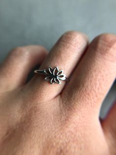 Silver Lotus Flower Ring - Sterling Silver [R1024] Quantity : One Ring Color : Silver Material : Sterling Silver Ring Size : 6 / 7 / 8 / 9 Band Size : about 1.5mm wide and 1mm thick Lotus Size : 10mm * 6mm * Metal components are Sterling Silver. * Suitable for delicate and sensitive skin. * Comes in a jewelry box. If you need extra boxes for gifting....just let us know! Flower Shaped Stackable Rings For Gift, Nickel-free Flower Shaped Ring, Adjustable Nickel-free Flower-shaped Rings, Hypoallergenic Flower Shaped Promise Ring, Hypoallergenic Flower Ring For Promise, Hypoallergenic Flower Promise Ring, Hypoallergenic Flower Ring For Gift, Hypoallergenic Flower Ring Gift, Adjustable Hypoallergenic Flower Ring