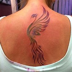 a woman with a tattoo on her back