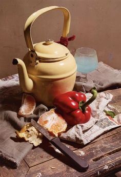 a tea pot and some food on a table