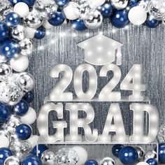 the words graduation surrounded by balloons and confetti in silver, blue and white colors