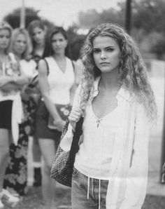 a group of women standing next to each other