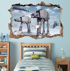 a star wars scene is shown on the wall above a bed in a child's bedroom