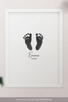 a baby's foot print with the name emma in black ink on a white background