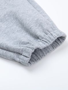 Details: Refreshing light gray color sweatpants Loose drawstring leg design Elasticated waist with side pockets Materials & Care: Cotton 93.5%, Nylon 6.5% Hand wash | Dry clean Do not bleach Size & Fit: Model is 5'7", Bust 32, Waist 24, Hips 35, wearing a size S Item #: EM2PA36 Gray Drawstring Bottoms For Winter, Winter Gray Bottoms With Drawstring, Gray Joggers With Drawstring, Gray Drawstring Pants For Jogging, Gray Stretch Joggers With Drawstring, Gray Leisure Joggers With Drawstring, Gray Cotton Joggers With Ribbed Waistband, Gray Drawstring Joggers For Leisure, Gray Cotton Pants With Elastic Cuffs