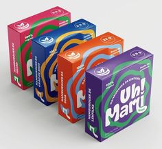 four boxes of uni marzi are stacked on top of each other in different colors