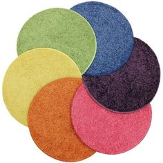 five different colored discs on a white background