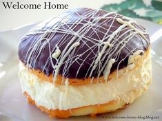 a close up of a doughnut on a plate with icing and toppings