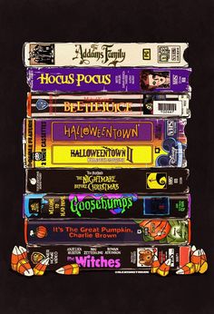 a stack of halloween movies stacked on top of each other in front of a black background