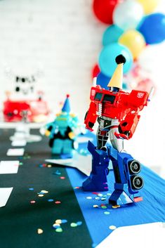 a table topped with toys and confetti