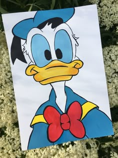 a drawing of donald the duck wearing a bow tie with flowers in the back ground