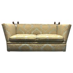 an upholstered couch is shown against a white background