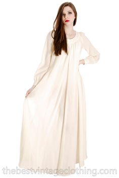 "Vintage Vuokko Nurmesniemi full length maxi dress of ivory or off white pure new wool voile with a super full sweeping hemline and bias cut style. It is a gown that can be worn loose, or belted for a different look. It WOULD make a beautiful wedding gown. Vuokko Nurmesniemi was a principal designer for Marimekko, and known for bold color and shape combinations, whimsical looks. Marked Size: xxs but measurements show it will fit up to a large Bust: 48\" Waist: Free Hips: Free Shoulders: 15\" Sle Cream Long Maxi Dress For Daywear, Cream Maxi Length Gown, Cream Long Maxi Dress For Wedding, Off White Maxi Dress For Daywear, Tea Gown, Pink Sheath Dress, Cocktail Dress Vintage, Beautiful Wedding Gowns, Tent Dress