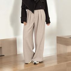 Upgrade your office attire with these pleated wide leg trousers. Designed for a refined and polished appearance, these trousers feature a high-waisted design, button closure, and zipper fly. The subtle pleats add sophistication and the wide leg silhouette offers comfort and freedom of movement. Perfect for workwear or special events, these versatile trousers are a must-have for any wardrobe. Fabric: 97% POLYESTER 3% SPANDEX Fit: True to size S fits sizes 2-4 M fits sizes 6-8 L fits sizes 10-12 M Business Casual Wide-leg Pleated Pants, Casual Wide Leg Business Trousers, Modern Solid Color Wide Leg Ankle-length Pants, Chic Pleated Office Bottoms, Modern Pleated Bottoms For Office, Pleated Wide Leg Pants For Fall, Pleated High-waist Wide Leg Pants, Modern Ankle-length Wide Leg Pants, Modern Pleated High-waisted Pants