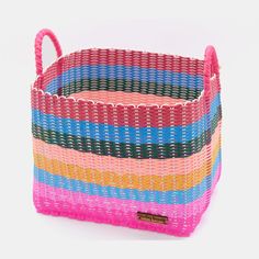 a multicolored basket with handles on a white background