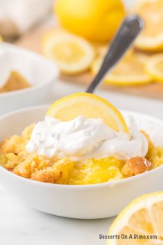 a bowl filled with lemon cobbler on top of a table