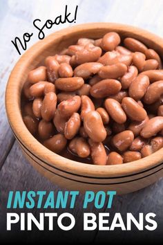 a wooden bowl filled with pinto beans and the words instant pot pinto beans on it