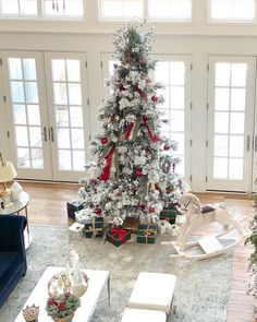 a decorated christmas tree in a living room