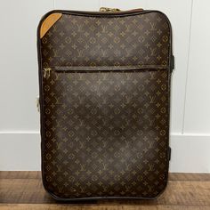 Louis Vuitton Pegase 70 Monogram Authentic Rolling Suitcase. Comes From A Pet & Smoke Free Home. Rare & Hard To Find In This Size! Some Minor Flaws As Shown In Photos, However Nothing That Effects The Functionality Of It To Be Expected With Its Age. Louis Vuitton Has Been Making World Class Luggage Since 1896 And The Pegase 70 Is The Largest Size And Is No Longer Produced. It Carries On The Tradition Of Style And Luxury. Considered By Many To Be The "World's Ultimate Luggage", The Pegase 70 Features Louis Vuitton's Trademark Durable Monogram Coated Canvas With Natural Leather Trim. The Lined Interior Features Washable Polyamide With Plenty Of Pockets For Holding Smaller Items. Smooth, Nois Long Flight, World Class, Leather Trim, Natural Leather, Leather Trims, Travel Bags, Louis Vuitton Bag, Louis Vuitton Monogram, Bag Lady