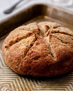 a loaf of bread sitting on top of a pan