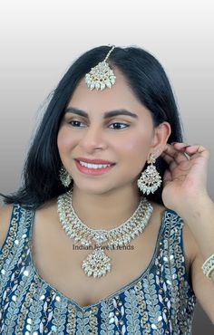 White Pearl Kundan Necklace Set/Kundan Bollywood Jewelry/Indian Jewelry/ Pakistani necklace/ Punjabi necklace/bridal necklace/Indian wedding Indo Western Classic Necklace With Gold Plating Regular Size And Adjustable Chand Necklace Indo-Western Necklace Set This is 100% Handmade jewelry. So Color, shades, texture displayed may slightly vary from the actual product due to digital image limitations. We request you to consider these minor variations. Please expect the possibility of some slight imp Silver Kundan Necklace With Mirror Work For Reception, Bollywood Mirror Work Wedding Necklaces, Bollywood Style Wedding Necklace With Mirror Work, Bollywood Style Wedding Necklaces With Mirror Work, Bollywood Wedding Necklaces With Mirror Work, Kundan Bridal Necklace With Mirror Work For Wedding, White Bridal Necklace With Mirror Work For Wedding, Bollywood Kundan Bridal Necklace For Reception, Festive Wedding Necklace With Mirror Work