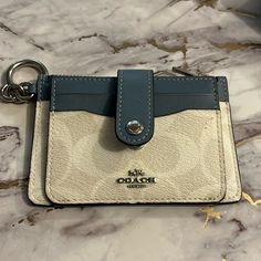 Used Once! Coach Id Wallet In Signature Cream And Blue, Perfect For Everyday Use Please Post Questions!!! 4.75” X 3.25 Inches Small Coach Wallet, Beabadoobee Concert, Wallets Coach, Car Keychain Ideas, Coach Mini Wallet, Wallet Keychain, Fav Products, Nike Backpack, Keychain Ideas