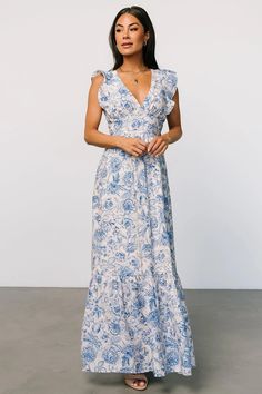 The Hampton maxi dress exudes timeless elegance with its blue and cream floral featuring a charming tie-back detail. Embrace effortless femininity allure with every wear, perfect for both casual outings and special occasions. Hunter Green Maxi Dress, Sparkle Gown, Burgundy Maxi Dress, Blue Floral Maxi Dress, Ethereal Dress, Ruffle Maxi Skirt, Velvet Wrap Dress, Baltic Born, Dress Dusty