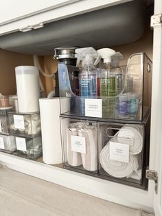 an organized bathroom cabinet filled with toiletries and personal care items for the guests to use