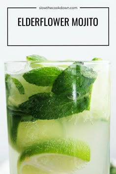 a glass filled with water and lime slices