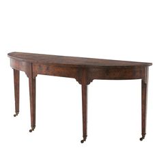 an old wooden table with wheels on the bottom and one drawer at the top, against a white background