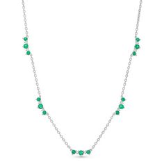 This beautiful, contemporary necklace features stations of emeralds totaling 1.21 carats and round brilliant cut diamonds totaling 0.13 carats. Fine Jewelry Emerald Necklaces With Diamond Accents, Fine Jewelry Green Diamond Necklace With Brilliant Cut, Emerald Necklace In Brilliant Cut, Fine Jewelry Emerald Necklace With Brilliant Cut, Fine Jewelry Green Emerald Necklace With Brilliant Cut, Green Brilliant Cut Necklace For May Birthstone, Green Diamond Necklace Fine Jewelry, Green Diamond Necklace In Fine Jewelry Style, Fine Jewelry Green Diamond Necklace