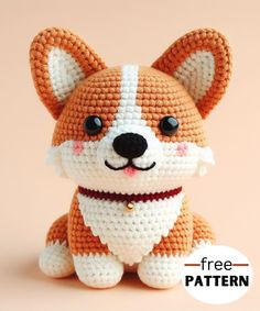 a small crocheted dog with a red collar sitting on top of a pink background