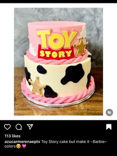 a toy story cake with pink frosting and stars on top