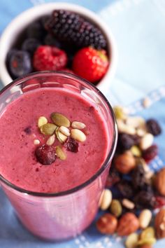 a smoothie with fruit and nuts in it