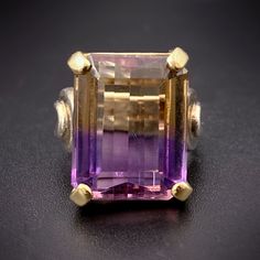 Ametrine, also known as trystine or by its trade name as bolivianite, is a naturally occurring variety of quartz. It is a mixture of amethyst and citrine with zones of purple and yellow or orange. Ametrine was not readily available on the market until the 1970s when it was discovered--or re-discovered--in Bolivia. The legends say a Spanish conquistador discovered the ametrine mine in the 1600s when he received the land after marrying a native princess named Anahi. He sent several specimens to Queen Isabella of Spain ... and then the mine was lost for centuries. When it was rediscovered, it was named after the legendary princess, whose land it once was. As a stone of both balance and connection, ametrine is believed to relieve tension, bring serenity and stimulate creativity, as well as bal Queen Isabella Of Spain, Ametrine Jewelry, Queen Isabella, Ametrine Ring, Amethyst And Citrine, Spanish Conquistador, Purple And Yellow, Pretty Clothes, Bolivia