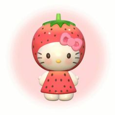 a hello kitty figurine with a strawberry on it's head and polka dot dress