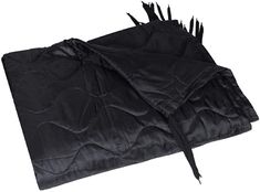 the black blanket has spikes sticking out of it