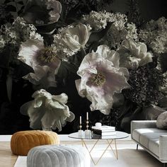 a living room with flowers on the wall