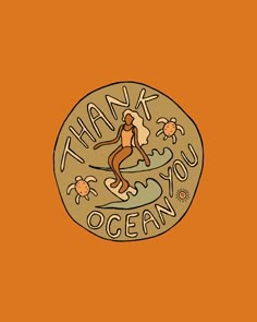 a coin with the words thank you ocean on it and a woman surfing in the water