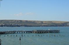 a pier in the middle of some water