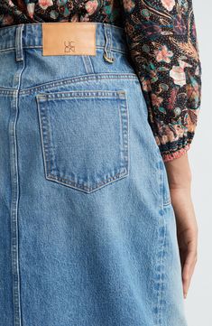 This casual-cool denim midi skirt is designed in a faded wash and punctuated with an airy front vent. 33 1/2" length (size 8) Exposed-button fly Front patch pockets; back patch pockets Front vent 100% cotton Machine wash, tumble dry Made in the USA of imported fabric Spring Medium Wash Denim Skirt With Five Pockets, Spring Denim Blue Skirt With Five Pockets, Relaxed Light Wash Denim Skirt, Denim Midi Skirt, Back Patch, Ulla Johnson, Midi Skirt, Nordstrom, Skirt