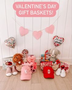 valentine's day gift baskets with teddy bears and hearts on the wall behind them