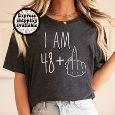 48 plus 1 birthday shirt, Custom shirt for 49th birthday, Middle finger shirt, funny birthday girl crewneck, birthday cruise shirt for her Express shipping available. Please choose "express shipping" at checkout. If not, it will default to standard shipping and will not arrive as quickly. I'm a star seller with a passion for design. If you have any questions about this listing please feel free to send me a message. I can customize most items so feel free to ask. SIZING: -Please refer to size cha 49 Birthday Shirt Ideas Women, Fun Fitted T-shirt For Birthday, Birthday Crew Neck T-shirt With Funny Text, 39 + 1 Birthday Shirt, Novelty Birthday T-shirt With Crew Neck, Birthday Cruise Shirt, 49th Birthday, Funny Birthday Shirts, 49 Birthday