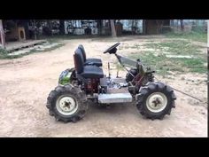 a small four - wheeled vehicle parked in the dirt