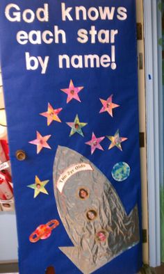 a bulletin board with an image of a rocket ship and the words god knows each star by name