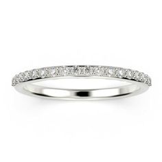 a white gold wedding ring with diamonds on the sides and a thin band in the middle