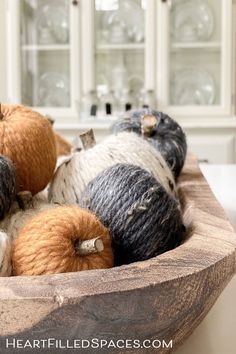 several balls of yarn are in a bowl