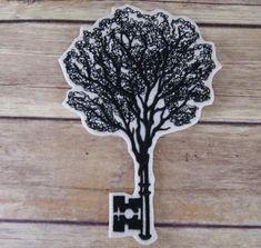 a sticker with a tree on it sitting on top of a wooden table